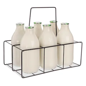 Six glass milk bottles in a wire carrier.