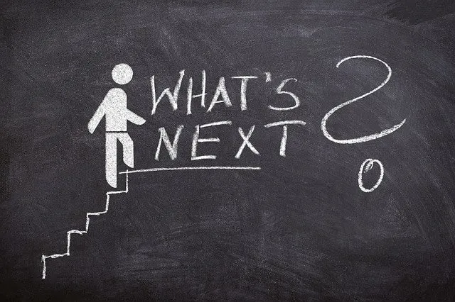 A chalk figure on a staircase beside the words “What’s next?”.